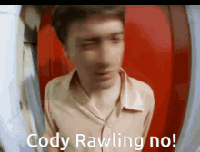 a blurry picture of a man with the words cody rawling no written below him