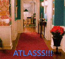 a hallway with a red carpet and the words atlasss in blue letters