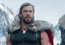a man with a beard wears a fur collar
