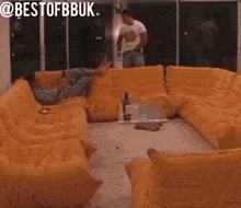 a blurry picture of a person standing in a room with the words bestofbbbuk written above them .