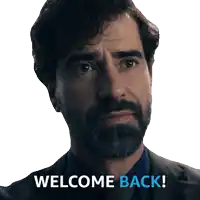 a man with a beard says welcome back on a white background