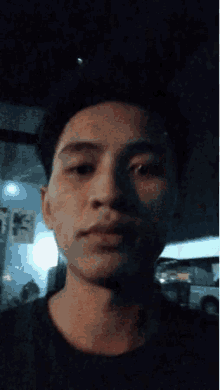 a close up of a man 's face with a knife in his hand .