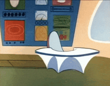 a cartoon character is sitting at a desk in front of a wall that says 0000 on it