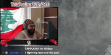 a man wearing headphones is sitting in front of a computer screen with total subs 220/210