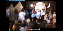 a group of people watching a show with the words " i was a proper show-off "