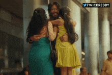 a man is hugging two women and a little girl with the hashtag 7wickreddy below him