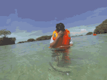 a blurred image of a person swimming in the water
