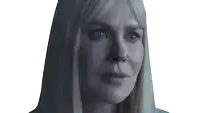 a close up of a woman 's face with a serious look on her face
