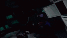 a cartoon character is standing in a dark room holding a sword .