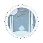 a polar bear wearing a hat with the letter b on it looks out a window