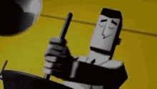 a black and white cartoon character is sitting on a chair holding a gun .
