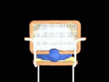 a cookie monster is sitting in a chair with a newspaper