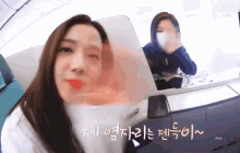 two women are sitting on a plane and one has a mask on