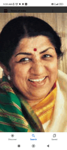 a screenshot of a woman 's face with the times of india app open