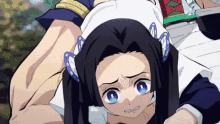 a girl with long black hair and blue eyes is laying on a man 's back