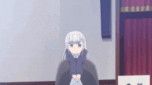 a girl with white hair is sitting in a chair with her legs crossed