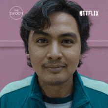 a close up of a man 's face with a netflix logo in the corner .