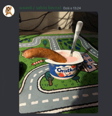 a picture of a yogurt with a sausage in it