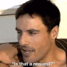 a man is asking " is that a request " while sitting on a couch