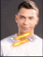 a blurry picture of a man with a flame coming out of his neck