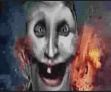 a close up of a person 's face with fire in the background