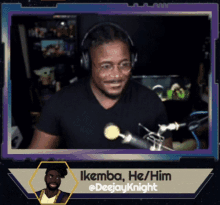 a man wearing headphones and glasses is smiling in front of a microphone with the name ikemba he him on the bottom