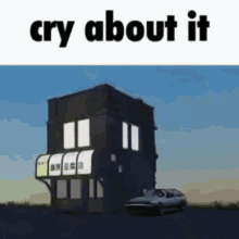 a car is parked in front of a building with the words cry about it