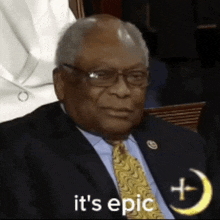 a man in a suit and tie with the words it 's epic