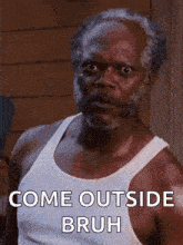 a man with a beard is wearing a white tank top and says " come outside bruh "
