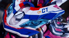 a red white and blue motorcycle with the word gt on it