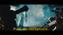 a movie scene with the words punk ass decepticon in yellow