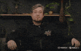 a man is holding a gun in front of a fire and the words minimax and haliluo ai are visible