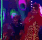 a woman in a red dress is standing in front of a pole