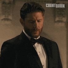 a man in a tuxedo with the word countdown on the bottom right