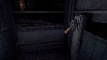 a person wearing a yellow glove is pressing a red button