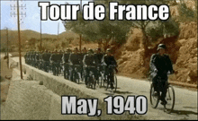 a group of soldiers riding bicycles down a road with the date may 1940