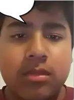 a close up of a person 's face with a speech bubble above his head