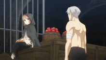 a man and a woman are standing next to each other in a dark room