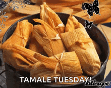 a bowl of tamales with the words tamale tuesday in the corner