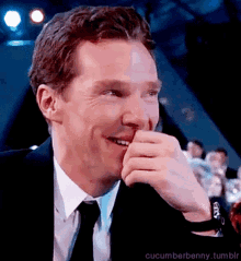 a man in a suit and tie is smiling with the words cucumberbenny.tumblr written below him