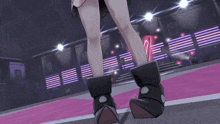 a person wearing a pair of black boots with white dots on the bottom