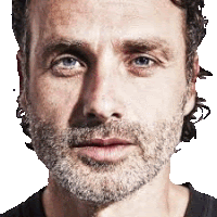 a man with a beard is looking at the camera .