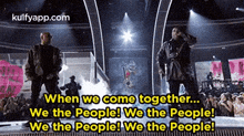 two men are standing on a stage with the words when we come together ... we the people