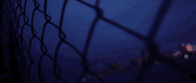a blurry picture of a chain link fence with a glitch effect that says npo