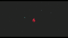 a large red object in the middle of a black background