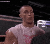 a man is wearing a pink shirt that says fullmetal