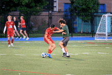 a soccer player wearing a green jersey with the number 21 on it