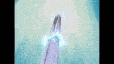 a very tall building with a blue light coming out of the top