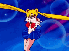 a cartoon of a girl in a blue dress with a yellow ribbon around her head .
