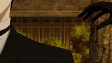 a man in a suit and tie is standing in front of a brick wall and a tree .
